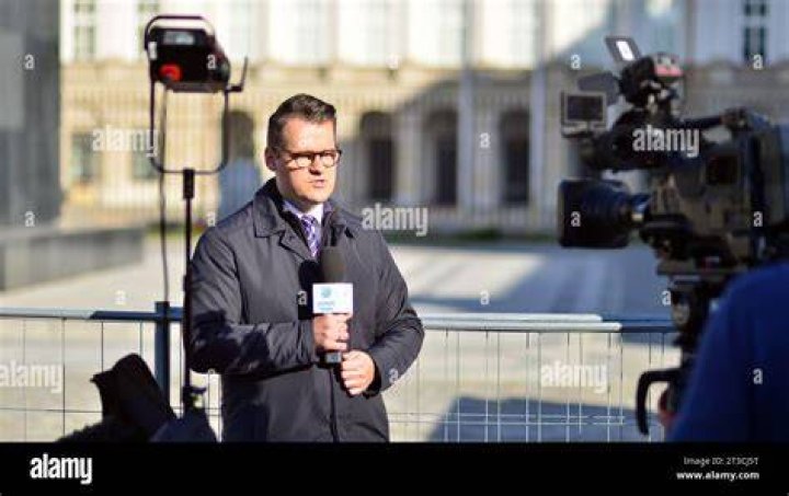 How do news reporters look at the camera?